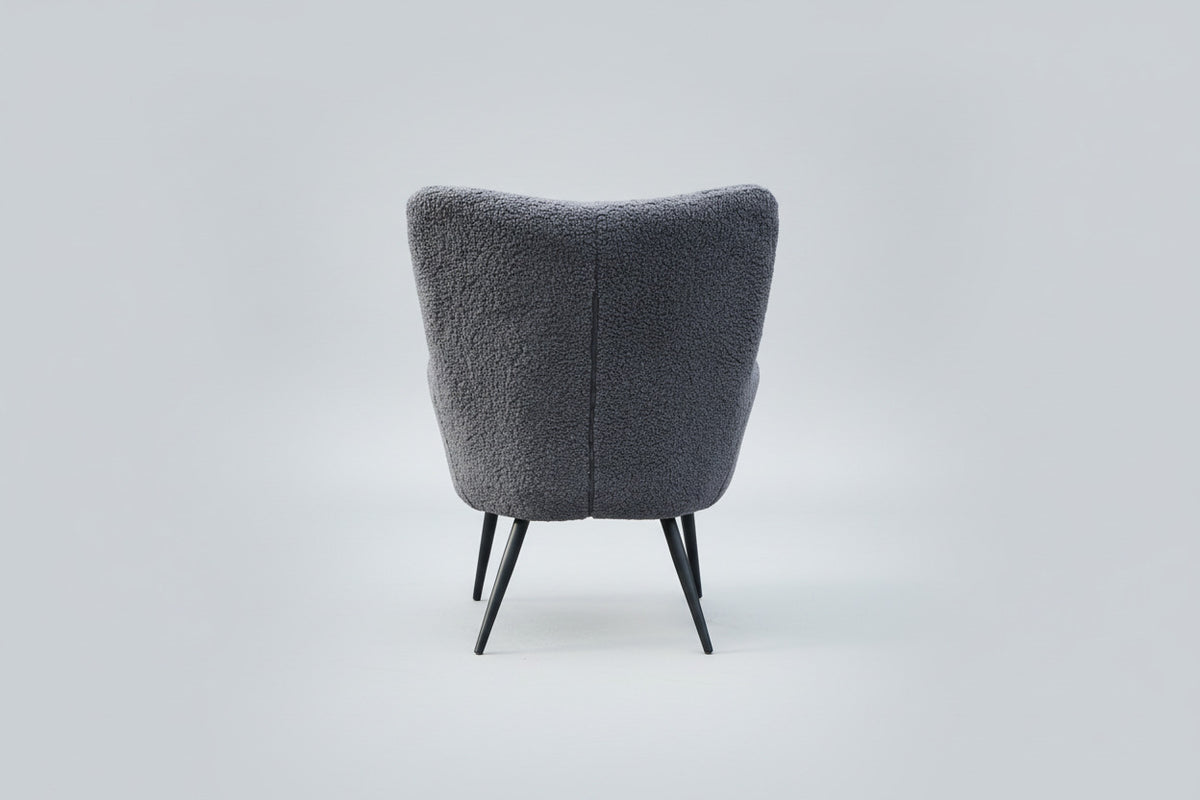 Bloomingville Perry loungestol med grå bouclé og sorte metalben set bagfra