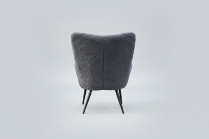 Bloomingville Perry loungestol med grå bouclé og sorte metalben set bagfra
