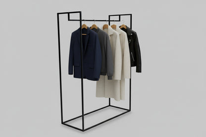 Sort tøjstativ i pulverlakeret stål med ophængt tøj i moderne interiør