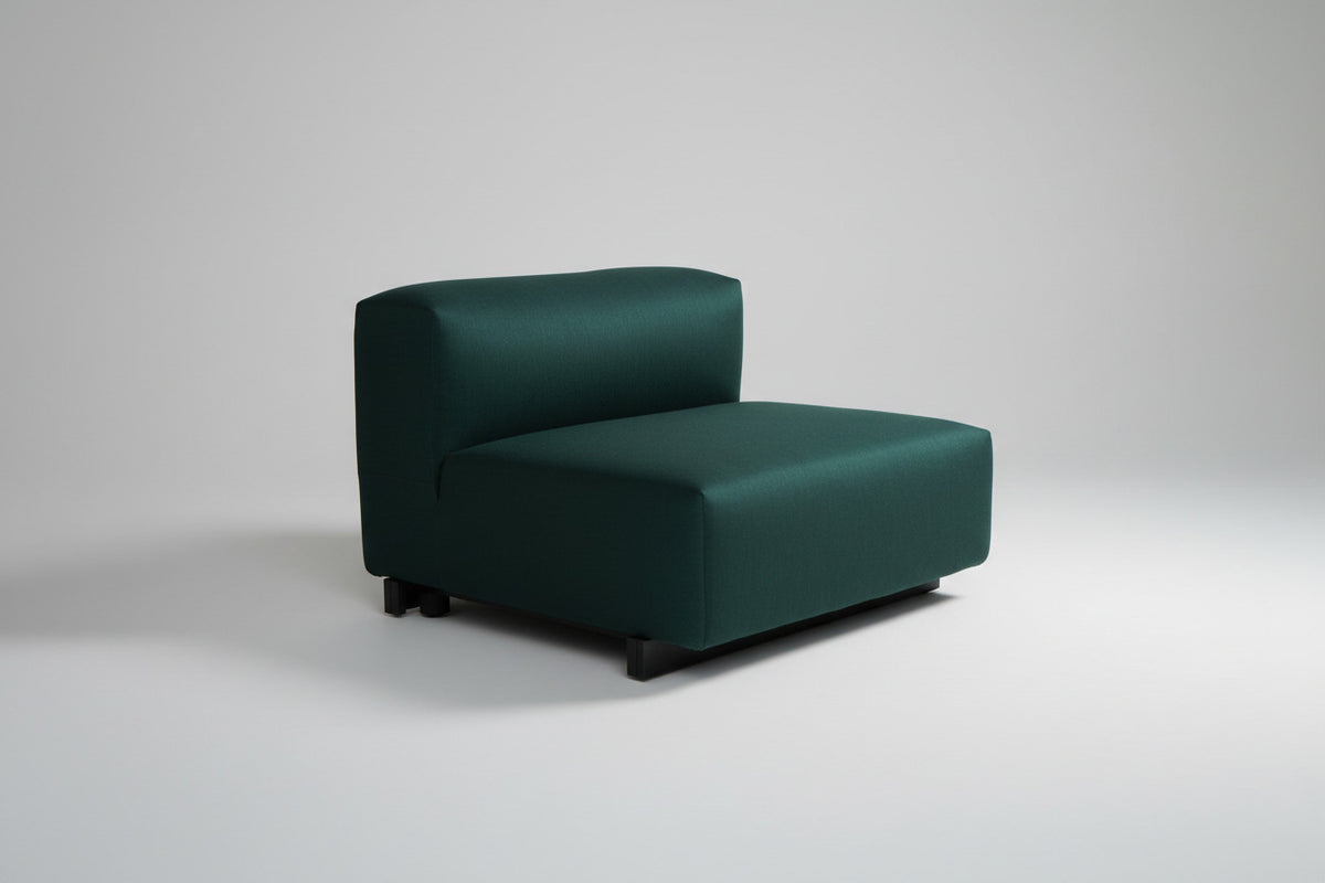 Vitra turkisgrøn modulsofa med ryg og sorte ben set skråt